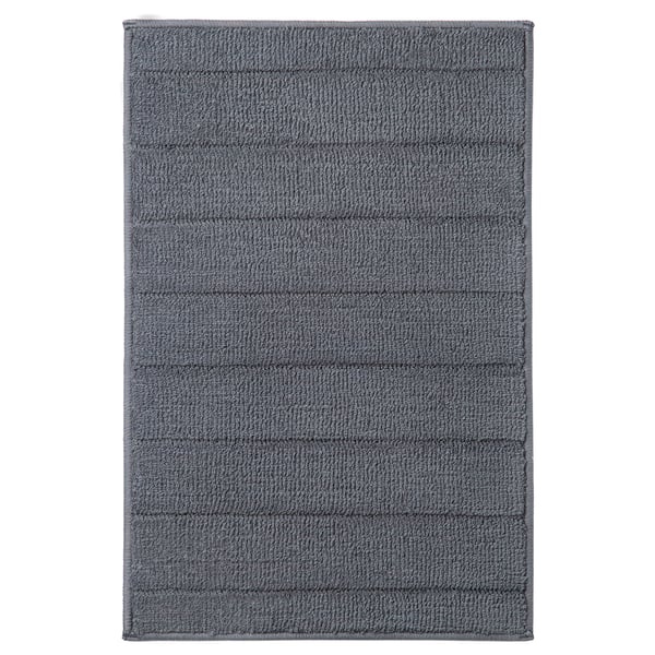 Grey TIDNINGSBUD bath mat, recycled polyester, textured, latex backing.