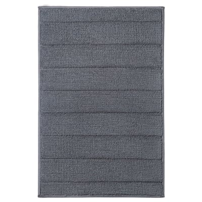 Grey TIDNINGSBUD bath mat, recycled polyester, textured, latex backing.
