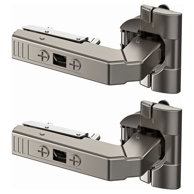 Two nickel-plated steel UTRUSTA hinges shown, adjustable, with screws, rectangular shape, for kitchen doors.