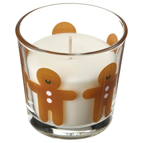 White glass candle in clear jar with gingerbread people design, two wicks.