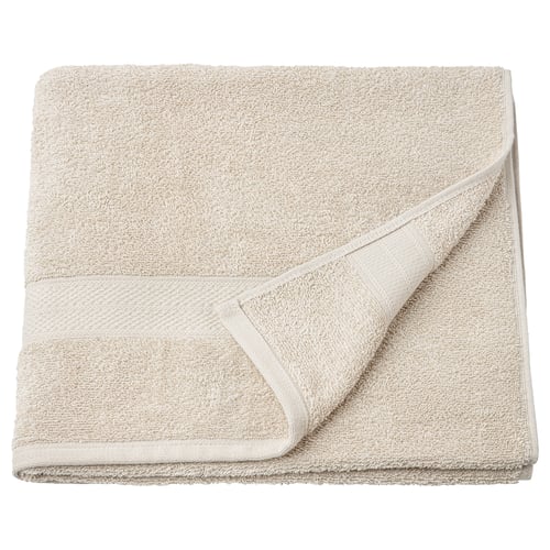 Folded light tan VITBACKEN bath towel, soft cotton terry, classic rectangular design.