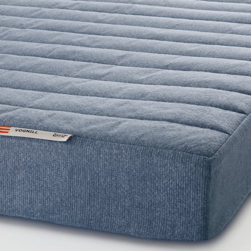 Close-up of grey VOGNILL mattress, showcasing its textured surface and durable coconut fibre design.