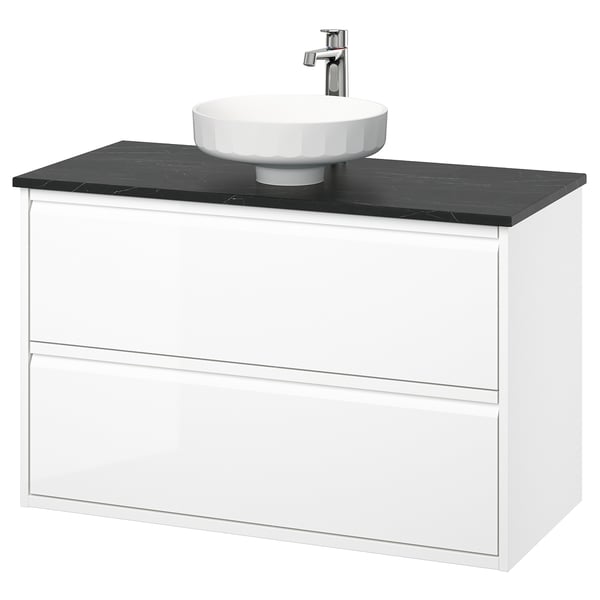 Mobile bagno moderno sospeso bianco con piano nero e lavabo rotondo.