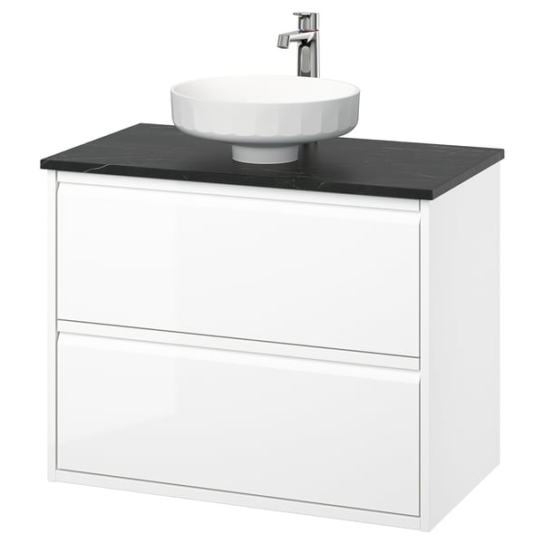 Moderno mobile da bagno sospeso bianco con piano di lavoro nero e lavabo rotondo, design elegante.