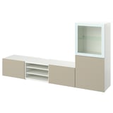 Mobile mobile porta tv BESTÅ bianco e beige con ripiani regolabili e vetrina.