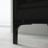 Mobile TV BESTÅ nero con eleganti gambe in metallo curvato.