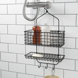 Carrello da doccia in filo nero con due livelli per bottiglie e sapone, ganci sottostanti per asciugamani, bulloneria di montaggio inclusa.