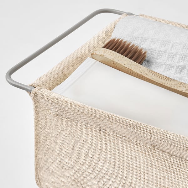 Contenitore Bollöskund beige, con manico, dimensionato per cassetti, con rete e telaio in acciaio.