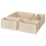 Quattro scatole portaoggetti in tessuto beige, di forma rettangolare, annidate insieme, ideali per organizzare gli oggetti.