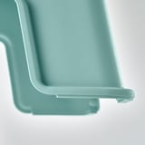 Robusto sgabello verde acqua con rivestimento antiscivolo, costruito per garantire stabilità e sicurezza.