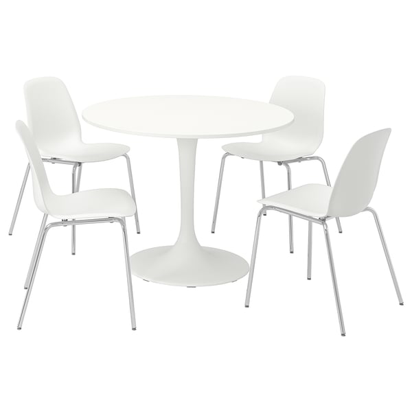 Un set da pranzo DOCKSTA con un tavolo rotondo bianco e quattro sedie abbinate, progettato per piccoli spazi con un look moderno e confortevole.