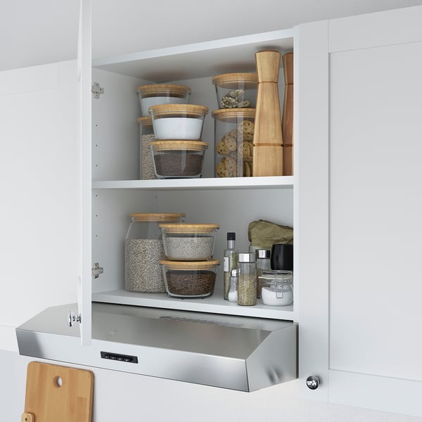 Mobile da cucina organizzato con contenitori impilabili e un portautensili per una conservazione efficiente.
