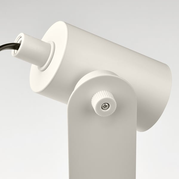 Moderna lampada da scrivania bianca con luce regolabile, che mostra design e materiali di qualità.
