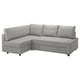 Opzione: Divano letto a L grigio con contenitore, rivestimento grigio chiaro, cuscini sagomati, design angolare.