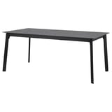 Un tavolo da pranzo allungabile GILLANDA con piano grigio scuro, effetto pietra, ed eleganti gambe in metallo nero. Design moderno e minimalista.