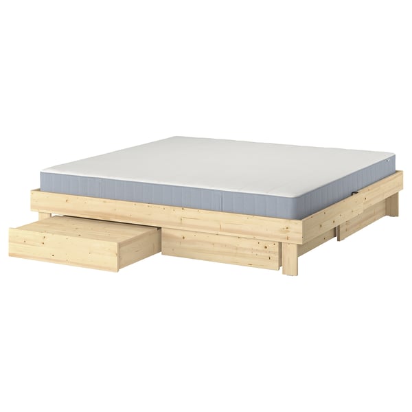 Letto allungabile in legno GLAMBERGET con materasso bianco, colore legno naturale, forma rettangolare e contenitore integrato.