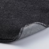 Primo piano del panno per la pulizia testurizzato nero, che mostra materiale spesso e resistente.