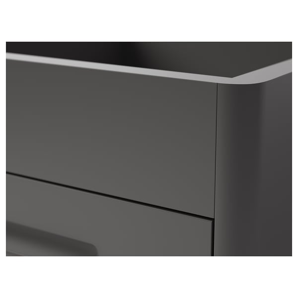 Primo piano dell'elegante cassettiera grigio scuro con bordi lisci, che mostra un design moderno e finiture di alta qualità.