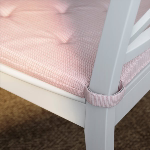 Sedia in metallo bianco con cuscini a righe rosse e bianche.