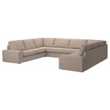 Questa immagine è un divano componibile ikea KIVIK in beige, che mostra un design moderno e pulito con cuscini profondi e braccioli rimovibili.