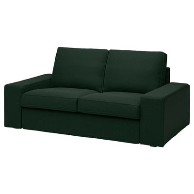 Un divano KIVIK in verde scuro dal design moderno, rivestito in resistente e morbido tessuto di ciniglia.