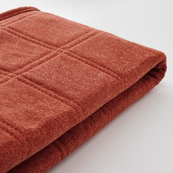 Primo piano di tessuto rosso resistente e strutturato, che mette in mostra cuciture intricate e artigianato di alta qualità.