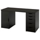 Scrivania ikea nera con cassetti e armadio.