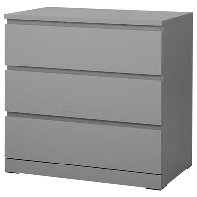 Una cassettiera MALM grigia con tre cassetti. Design moderno e pratico per le camere da letto.