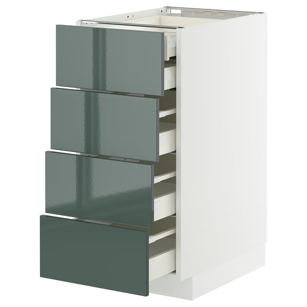 Moderno mobile da cucina bianco con quattro cassetti lucidi grigio-verdi.