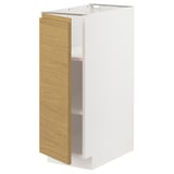 Un mobile da cucina METOD bianco con frontale in rovere chiaro e maniglie integrate, caratterizzato da un design minimalista e caldo.