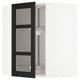Mobile da cucina nero con ante in vetro smerigliato, parte del sistema IKEA METOD. Ripiani regolabili, design tradizionale.