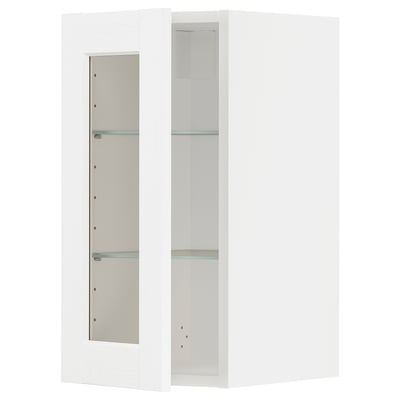 Un mobile da cucina ikea METOD bianco con ante e ripiani in vetro.
