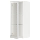 Un mobile da cucina METOD bianco con ripiani in vetro e ante con struttura in metallo. L'armadio ha un ripiano regolabile e un design moderno.
