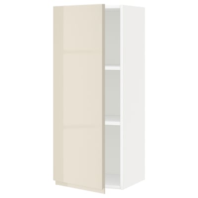 Moderno mobile bianco con anta liscia beige, finitura lucida, ripiano singolo regolabile.