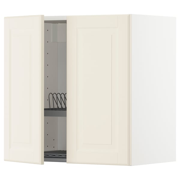 Mobile da cucina bianco sporco con anta aperta che mostra la griglia nera all'interno, parte del sistema IKEA METOD, forma rettangolare dal design semplice.