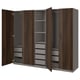 Armadio PAX in marrone scuro, ante aperte, struttura legno, interno grigio con ripiani e cassetti.