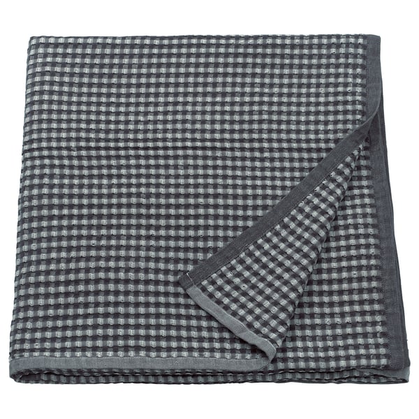 Copriletto in cotone PELARTUJA a scacchi grigio, reversibile, forma quadrata con trama a nido d'ape.