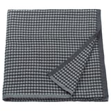 Copriletto in cotone PELARTUJA a scacchi grigio, reversibile, forma quadrata con trama a nido d'ape.