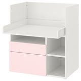 Raffigura una scrivania per bambini bianca e rosa chiaro con contenitore. È un design a scaffale aperto, adatto per il gioco e lo studio.