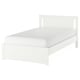 Letto SONGESAND bianco dalle linee pulite e dalle gambe alte, con materiali in fibra di legno e truciolare.
