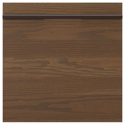 Un frontale per cassetti in legno marrone scuro della serie STENSTA, caratterizzato da un motivo a venature del legno naturale e da eleganti maniglie orizzontali.