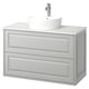 Mobile TÄNNFORSEN bianco con lavabo curvo, mobile grigio chiaro, montaggio a parete, bordi smussati.