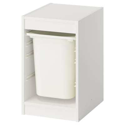 Un organizer per bambini TROFAST bianco con un cestino di plastica e un ripiano verde.