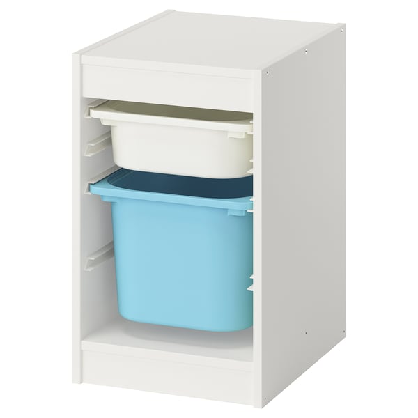 Un mobile contenitore ikea TROFAST bianco con contenitori in plastica blu e bianchi.