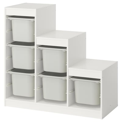 Un mobile contenitore TROFAST bianco con più ripiani e contenitori in plastica per organizzare i giocattoli dei bambini.