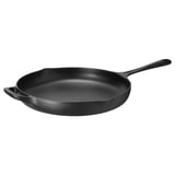 Padella in ghisa nera con manico lungo e manico ausiliario, finitura scura.