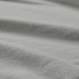 Primo piano di tessuto morbido e strutturato, che mette in mostra la sua qualità di cotone liscio e caldo.