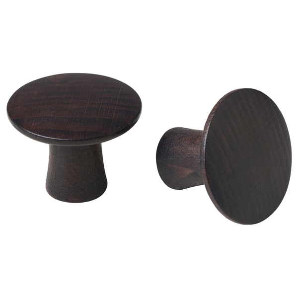 Due pomelli in legno marrone scuro, rotondi dal design semplice e classico, realizzati in faggio massello.