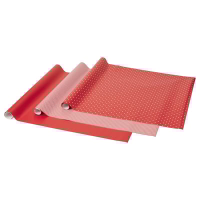 Confezioni regalo rosse con disegni solidi, a righe e punteggiati arrotolate.