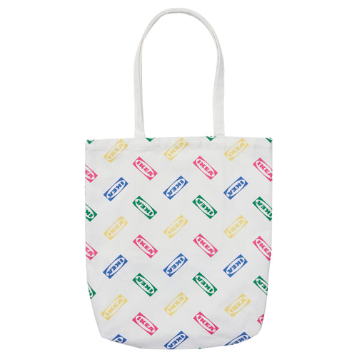 White tote bag with colourful IKEA logos, cotton material, rectangular shape, long handles.